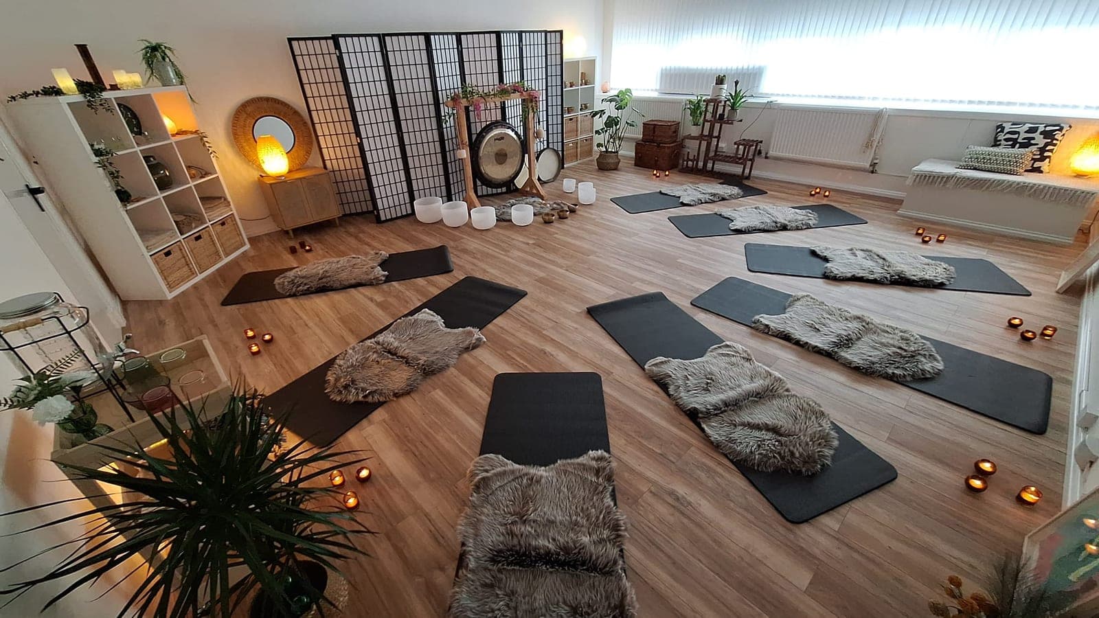 Small-group sound bath room with mats, blankets and gong at The Reset Room Glasgow