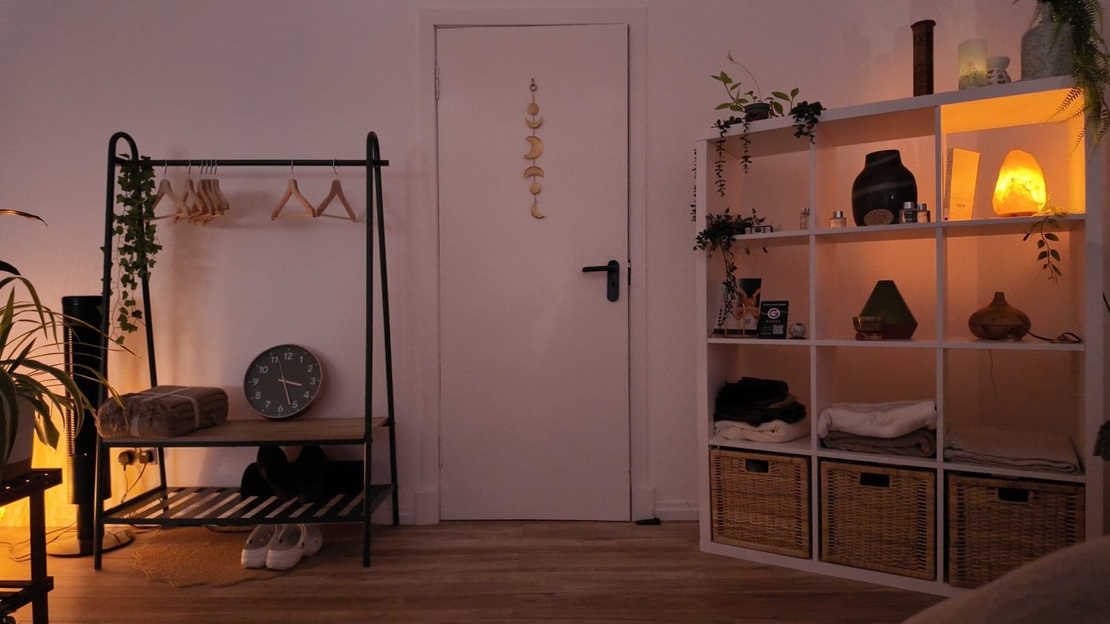 Clothes rail, clock and shelving inside The Reset Room Glasgow treatment studio